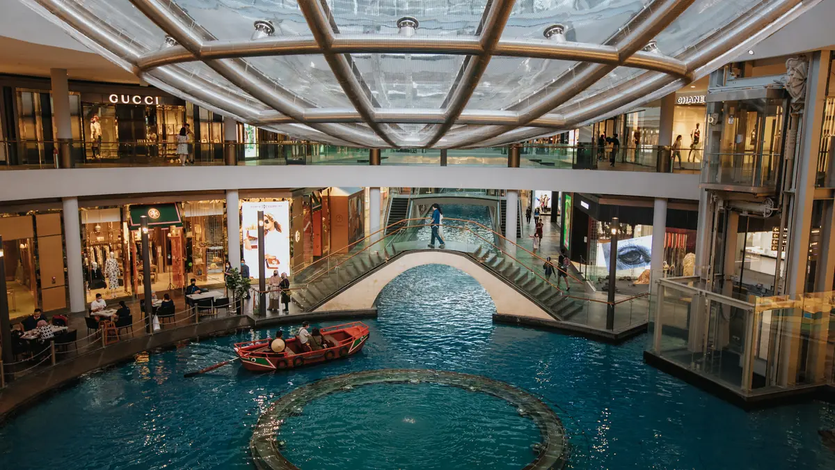 Marina Bay Sands — The indoor canal and sampan ride inside The Shoppes at Marina Bay Sands, under its glass roof