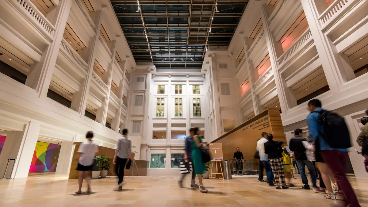 National Gallery Singapore — The high naturally lit atrium of National Gallery Singapore with visitors walking below