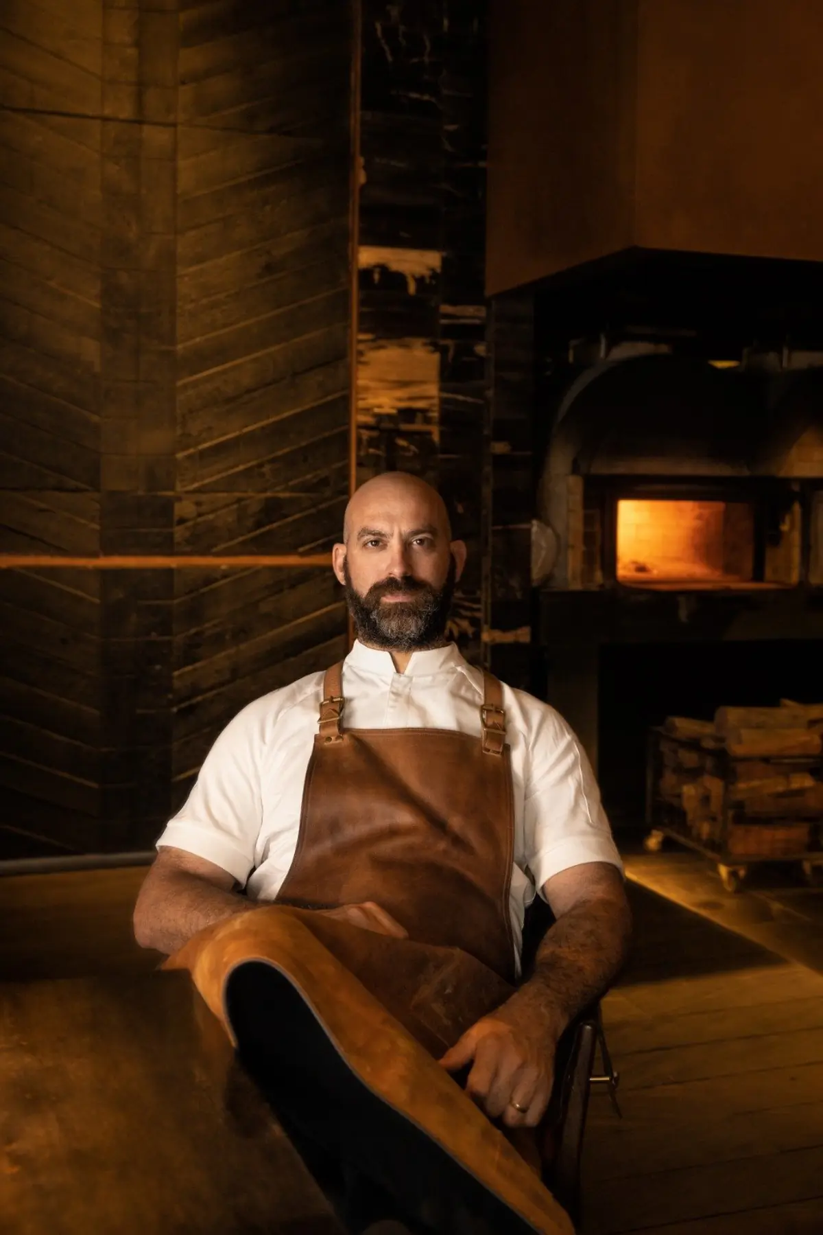Chef Dave Pynt at the wood-fired oven of Burnt Ends, Singapore