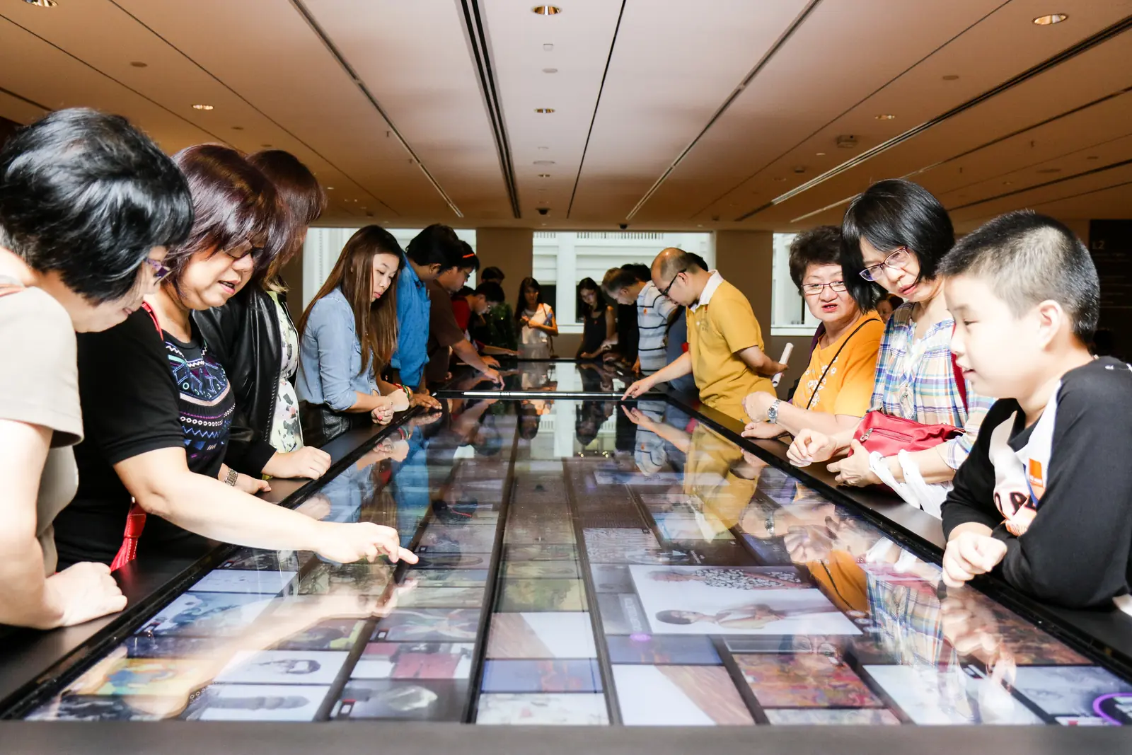 National Gallery Singapore — Visitors seated at the communal Social Table inside National Gallery Singapore