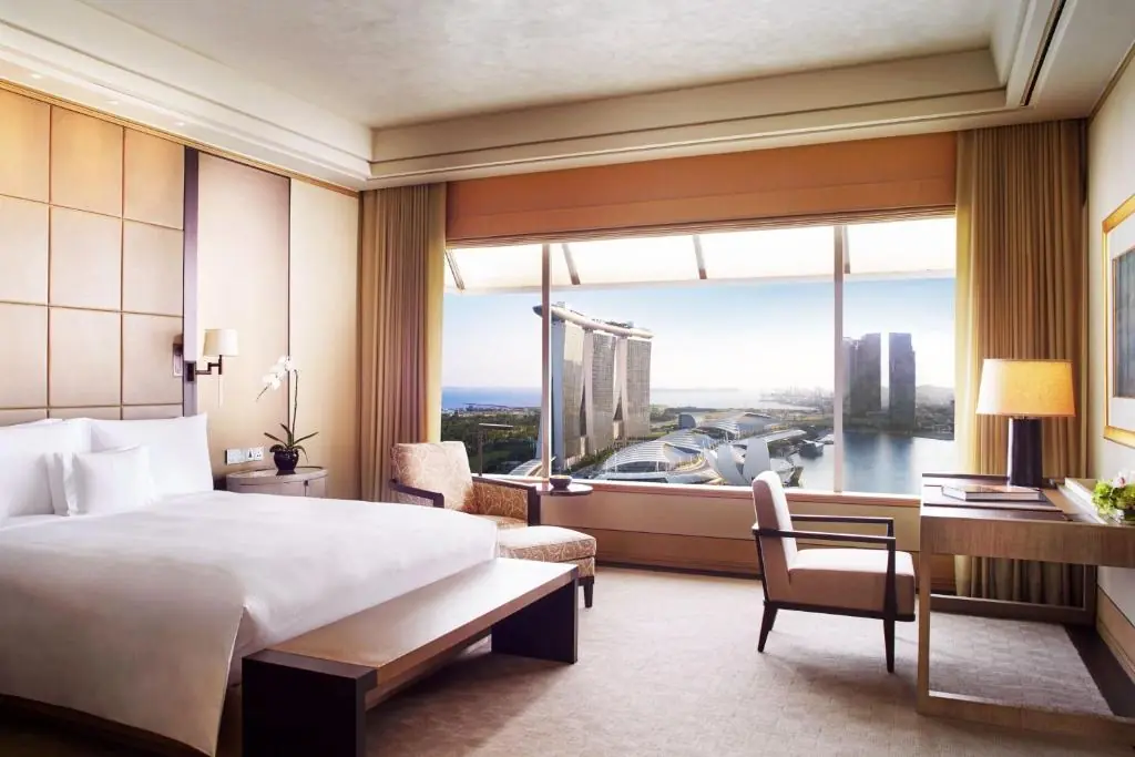 The octagonal bathroom window overlooking Marina Bay at The Ritz-Carlton, Millenia Singapore